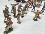 many figurines of soldiers that are on the table