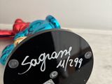 a sign that says sugar king on the side of a black plate