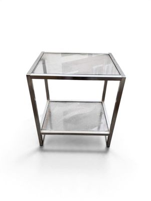 an image of a glass and metal side table on a white background