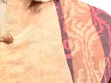 a close up of a jacket on a mannequin