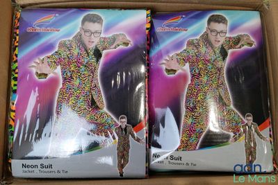 two boxes of sprinkles in the shape of a man in a suit