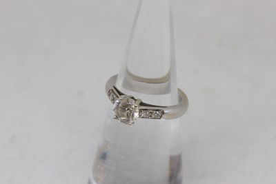 an image of a diamond ring on top of a clear glass