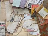 a pile of old papers on the floor of a room