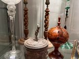 a glass display case filled with glass vases and other items