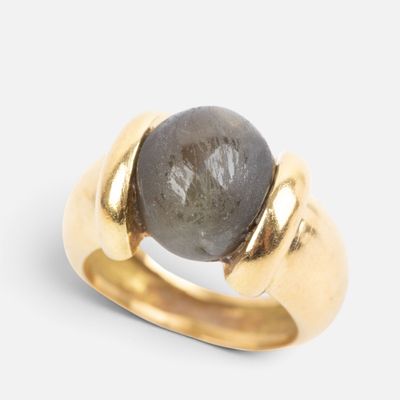an image of a close up of a ring with a stone on it