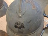 two helmets sitting on top of a table in a room