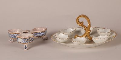 a small plate with a small bowl and a small bowl on it