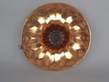 a gold plate with a flower design on it
