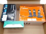 two phones in a box one is black and one is orange