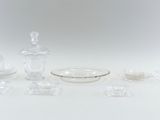several pieces of glass are arranged on a white surface