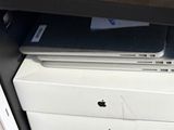 a stack of laptops sitting on top of each other