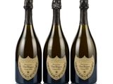 three bottles of champagne on a white background