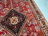 an image of a large oriental rug on a blue floor