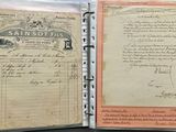 an old document with writing on it sitting on a table