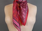a close up of a mannequin torso with a pink scarf on it