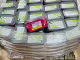 many containers of food sitting on top of a pallet