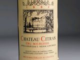 a bottle of wine that is sitting on a table