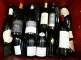 many bottles of wine sitting in a red box