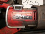 an image of a red tool that is sitting on a table