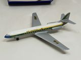 a model of a plane on a table next to a box
