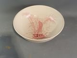 a plate with a picture of a palm tree on it