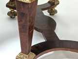 a table with a marble top and a wooden base