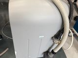 an image of a machine with a hose attached to it