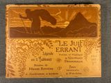 an old book with a picture of a man and a dog on it