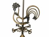 une image représentant une lampe surmontée d'un coq
