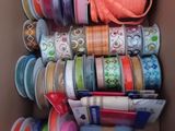 a box full of different types of ribbons in it