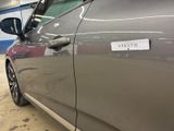 a car with a sticker on the side of it ' s door