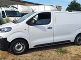 a white van that is parked in a lot