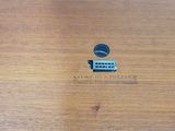a small button that is on a wooden table