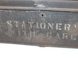 a metal box with a sign on it that says stationer