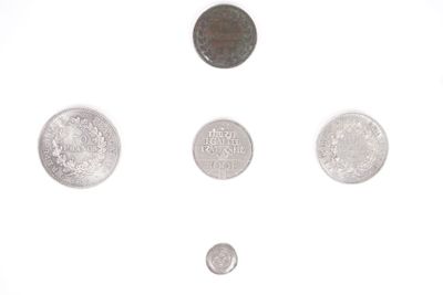 a lot of coins that are on a white surface