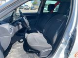 the interior of a car with the door open and the seat up