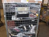 a metal cart with many items in it in a warehouse