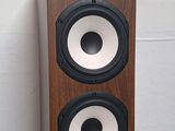 a close up of a speaker on a stand with a white background