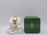 an image of a green box with a watch on it and a box with a watch on it