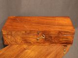 a wooden box that is open on a table