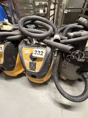 several vacuums are stacked on top of each other in a room