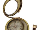 a gold pocket watch with roman numerals on it