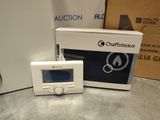 a digital thermostar sitting next to a box
