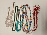 a lot of necklaces that are on a table