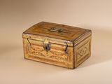 a small wooden box that has a lock on it