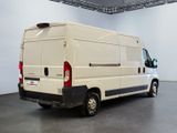 a white van that is parked in a room