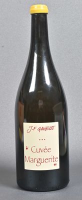a bottle of wine that is sitting on a table