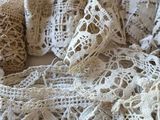 a pile of crocheted laces on a table