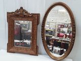 two mirrors sitting on a white table next to each other