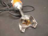 a silver and orange blender sitting on a table